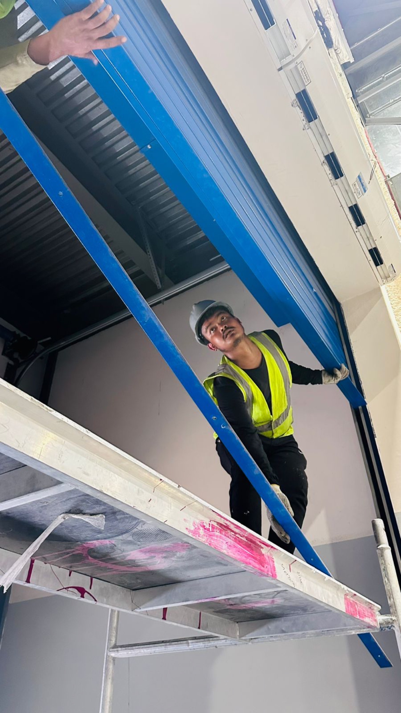 Close-up of rapid-roll high speed door installation in Dubai industrial facility