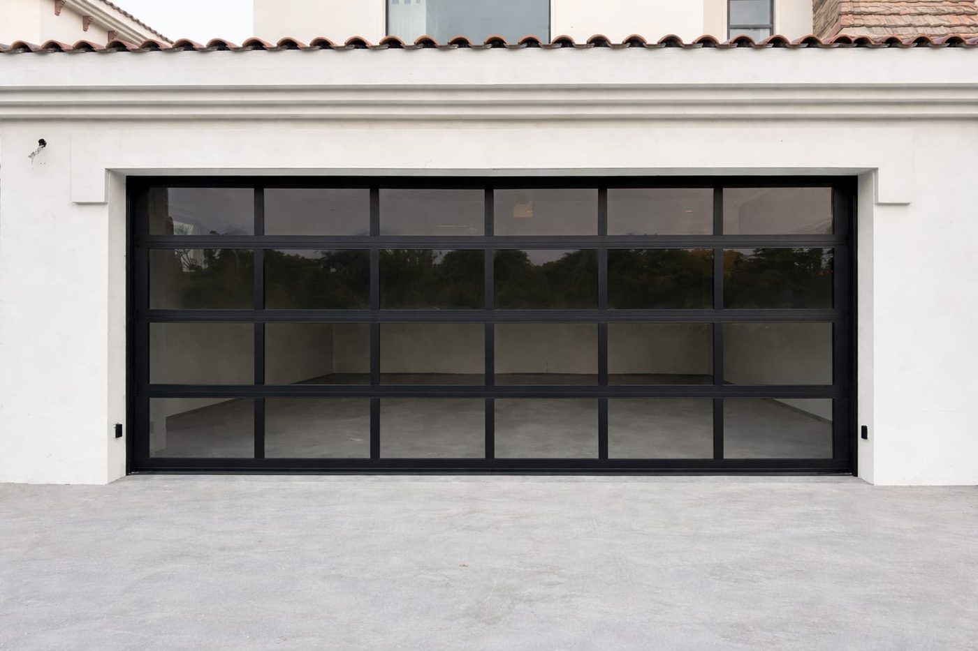 Glazed garage door with black frame — Dubai villa